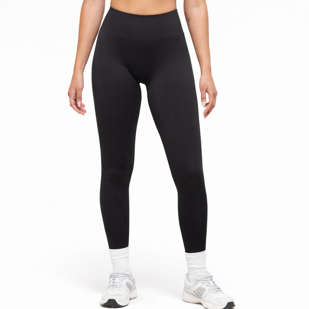 Girl's legs wearing black leggings and white shoes